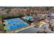 A great aerial view of the community tennis courts, swimming pool, and clubhouse shows a great place to meet your neighbors at 2220 Rainy Lake St, Wake Forest, NC 27587