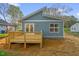 New backyard deck and blue vinyl siding exterior at 230 N Melville St, Graham, NC 27253