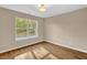 Bedroom with hardwood floors and natural light coming through the window at 230 N Melville St, Graham, NC 27253