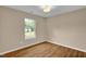 Bedroom with hardwood floors and natural light coming through the window at 230 N Melville St, Graham, NC 27253