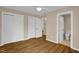 Bright bedroom with double closets and hardwood floors; modern and neutral at 230 N Melville St, Graham, NC 27253