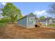 Exterior side view of blue house with new deck and steps at 230 N Melville St, Graham, NC 27253