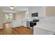 Modern kitchen featuring white cabinets, stainless steel appliances, and ample counter space for cooking at 230 N Melville St, Graham, NC 27253