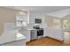 Stylish kitchen with white cabinets, stainless steel appliances, and a window providing natural light at 230 N Melville St, Graham, NC 27253
