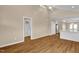 Bright space with modern flooring and an open layout connecting the living area to the kitchen at 230 N Melville St, Graham, NC 27253