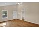 Bright room with vaulted ceiling, stylish flooring, and natural light from a large window at 230 N Melville St, Graham, NC 27253