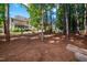 Expansive backyard with mature trees, lush foliage, and outdoor entertaining areas at 2739 Elderberry Ln, Apex, NC 27539