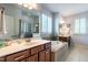 Bright bathroom with double vanity, garden tub, and separate glass shower at 2739 Elderberry Ln, Apex, NC 27539