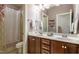 Dual vanity bathroom featuring a shower and separate toilet area at 2739 Elderberry Ln, Apex, NC 27539
