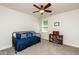 Well lit bedroom with carpet, fan, window, and bookshelf at 2739 Elderberry Ln, Apex, NC 27539