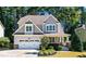 Charming two-story home with manicured landscaping and a welcoming front porch at 2739 Elderberry Ln, Apex, NC 27539