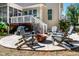 Inviting outdoor fire pit area with seating, ideal for relaxing evenings in the backyard at 2739 Elderberry Ln, Apex, NC 27539