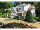 Beautifully landscaped front yard with lush greenery and a well-maintained lawn at 2739 Elderberry Ln, Apex, NC 27539