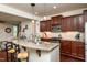Open kitchen with granite countertops, stainless steel appliances, and a center island at 2739 Elderberry Ln, Apex, NC 27539