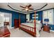 Spacious main bedroom with tray ceilings, a four-poster bed, and an attached office at 2739 Elderberry Ln, Apex, NC 27539