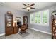 Bright office with built-in shelving and large window letting in plenty of natural light at 2739 Elderberry Ln, Apex, NC 27539