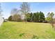 Expansive backyard showcasing a lush lawn and mature trees at 2782 N Shiloh Rd, Garner, NC 27529