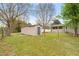 View of the home's backyard area featuring a shed surrounded by mature trees at 2782 N Shiloh Rd, Garner, NC 27529