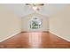 Spacious bedroom featuring hardwood floors, a vaulted ceiling, and ample lighting at 2782 N Shiloh Rd, Garner, NC 27529