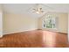Bright bedroom with a vaulted ceiling, hardwood floors, and a large window at 2782 N Shiloh Rd, Garner, NC 27529