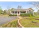 Charming single-story home with manicured front yard and inviting front porch and mature landscaping at 2782 N Shiloh Rd, Garner, NC 27529