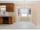 Kitchen area featuring a window nook with natural light and wood cabinets at 2782 N Shiloh Rd, Garner, NC 27529