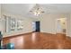 Living room with laminate flooring, ceiling fan, and a view of the front yard at 2782 N Shiloh Rd, Garner, NC 27529
