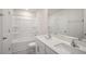 Clean bathroom featuring double sinks, vanity, ample lighting, and combination shower-tub at 291 Hanging Elm Ln, Fuquay Varina, NC 27526