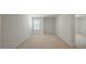 Spacious bedroom with neutral carpet and ample natural light at 291 Hanging Elm Ln, Fuquay Varina, NC 27526