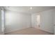 Large carpeted bedroom with natural light and an ensuite bathroom at 291 Hanging Elm Ln, Fuquay Varina, NC 27526