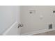 Laundry room space featuring connections, clean walls, and neutral flooring at 291 Hanging Elm Ln, Fuquay Varina, NC 27526