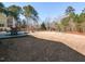 Expansive backyard features outdoor seating, play equipment, and a well-manicured lawn, perfect for recreation at 3059 Hyco Lake Ct, Fuquay Varina, NC 27526