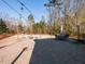 Spacious backyard boasts a large patio area, playground equipment, and lush landscaping, great for outdoor activities at 3059 Hyco Lake Ct, Fuquay Varina, NC 27526