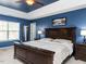 Elegant main bedroom with a tray ceiling, dark wood furniture, and a cozy atmosphere at 3059 Hyco Lake Ct, Fuquay Varina, NC 27526