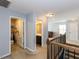 Upstairs hallway with laundry room and bathroom access, leading to a cozy living space at 3059 Hyco Lake Ct, Fuquay Varina, NC 27526