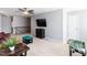 This living room offers ample space, natural lighting, and fun decor at 3059 Hyco Lake Ct, Fuquay Varina, NC 27526