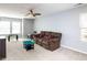 A spacious living room featuring plush seating and large windows at 3059 Hyco Lake Ct, Fuquay Varina, NC 27526