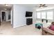 Open living room offers plenty of natural light and neutral carpeting at 3059 Hyco Lake Ct, Fuquay Varina, NC 27526
