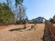 Backyard playground area with swings and a slide, perfect for entertainment and outdoor fun at 3059 Hyco Lake Ct, Fuquay Varina, NC 27526