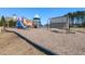 Community playground featuring colorful play equipment, surrounded by mulch and grassy areas at 3059 Hyco Lake Ct, Fuquay Varina, NC 27526