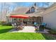 Spacious backyard featuring a large patio area with seating and lush landscaping at 3120 A Timberlyne Dr, Mebane, NC 27302