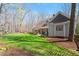 Landscaped backyard with a large patio, perfect for outdoor gatherings and relaxation at 3120 A Timberlyne Dr, Mebane, NC 27302