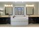 Bright bathroom with a large soaking tub, black cabinets, and stylish fixtures at 3120 A Timberlyne Dr, Mebane, NC 27302