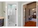Modern bathroom features a glass-enclosed shower with white tile and bronze fixtures at 3120 A Timberlyne Dr, Mebane, NC 27302