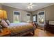 Inviting bedroom with a comfortable bed, natural light, and hardwood floors at 3120 A Timberlyne Dr, Mebane, NC 27302