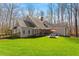 Charming home with well-maintained lawn, patio, and classic architectural details at 3120 A Timberlyne Dr, Mebane, NC 27302