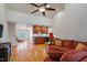 Open living room with high ceilings, wet bar, comfortable seating, and hardwood floors at 3120 A Timberlyne Dr, Mebane, NC 27302