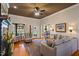 Cozy living room boasts hardwood floors, fireplace, comfortable seating, and French doors at 3120 A Timberlyne Dr, Mebane, NC 27302