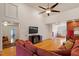 Bright living room boasts hardwood floors, high ceilings and a ceiling fan at 3120 A Timberlyne Dr, Mebane, NC 27302