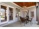 Covered patio with a table and chairs, offering a relaxing outdoor space at 3120 A Timberlyne Dr, Mebane, NC 27302